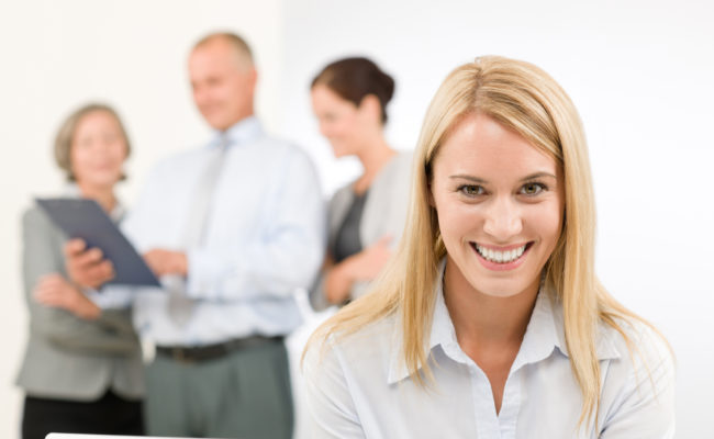 Business woman pretty with colleagues discussing